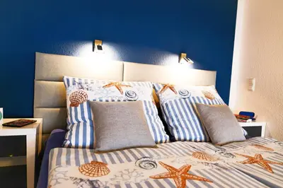 Ein Bett oder Betten in einem Zimmer der Unterkunft Strandhochhaus SG12