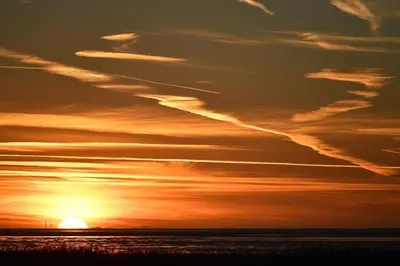 Blick auf den Sonnenuntergang/Sonnenaufgang von der Ferienwohnung aus oder aus der Nähe