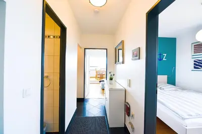 Ein Bett oder Betten in einem Zimmer der Unterkunft Strandhochhaus SHF3