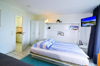Ein Bett oder Betten in einem Zimmer der Unterkunft Haus Horizont HZ14