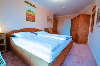 Ein Bett oder Betten in einem Zimmer der Unterkunft Haus Nordseebrandung NB53