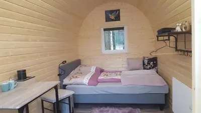Ein Bett oder Betten in einem Zimmer der Unterkunft Glamping Pod im Wald