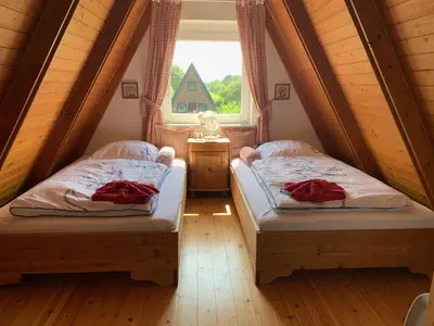 Ein Bett oder Betten in einem Zimmer der Unterkunft Ferienhaus am Meer