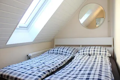 Ein Bett oder Betten in einem Zimmer der Unterkunft Ferienwohnung Krohn Cuxhaven