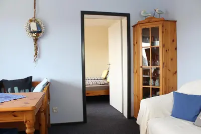 Ein Bett oder Betten in einem Zimmer der Unterkunft Ferienwohnung Krohn Cuxhaven