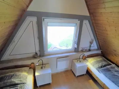 Ein Bett oder Betten in einem Zimmer der Unterkunft Ferienhaus „Buß“