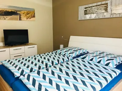 Ein Bett oder Betten in einem Zimmer der Unterkunft Residenz Passat Cuxhaven 2