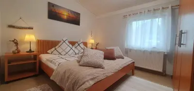 Ein Bett oder Betten in einem Zimmer der Unterkunft Ferienhaus Frische Brise direkt am Nordsee Deich