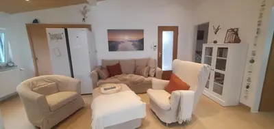 Ein Sitzbereich in der Unterkunft Ferienhaus Frische Brise direkt am Nordsee Deich
