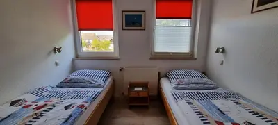 Ein Bett oder Betten in einem Zimmer der Unterkunft Haus Pamir