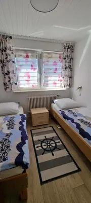 Ein Bett oder Betten in einem Zimmer der Unterkunft Haus Pamir