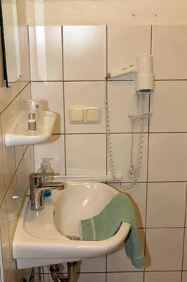 Ein Badezimmer in der Unterkunft Dithmarscher Haus