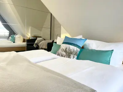 Ein Bett oder Betten in einem Zimmer der Unterkunft Meeresbrandung 37