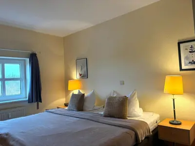 Ein Bett oder Betten in einem Zimmer der Unterkunft Residenz Deichgraf
