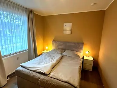 Ein Bett oder Betten in einem Zimmer der Unterkunft Residenz Haus am Mühlenpark