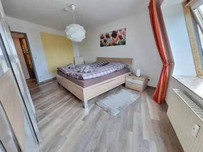 Ein Bett oder Betten in einem Zimmer der Unterkunft Meerblick 424