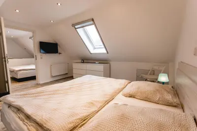 Ein Bett oder Betten in einem Zimmer der Unterkunft Strandbrise