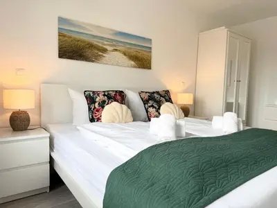 Ein Bett oder Betten in einem Zimmer der Unterkunft Nordseebrandung A2 1