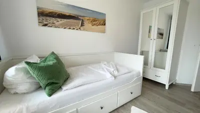 Ein Bett oder Betten in einem Zimmer der Unterkunft Nordseebrandung D1 5