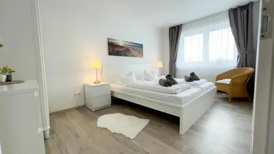 Ein Bett oder Betten in einem Zimmer der Unterkunft Nordseebrandung B2 1