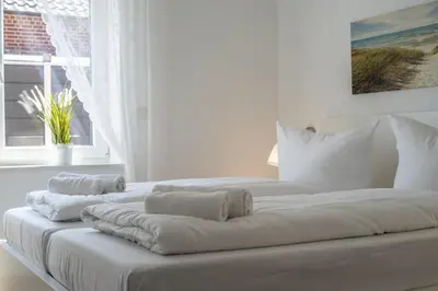 Ein Bett oder Betten in einem Zimmer der Unterkunft Duhner Strand Whg 2
