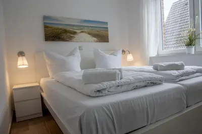 Ein Bett oder Betten in einem Zimmer der Unterkunft Duhner Strand Whg 4