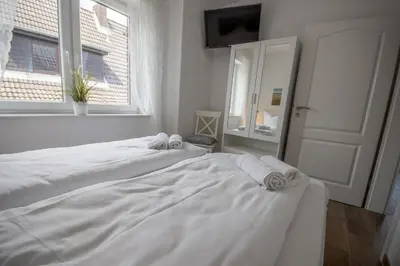 Ein Bett oder Betten in einem Zimmer der Unterkunft Duhner Strand Whg 4