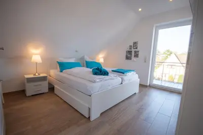 Ein Bett oder Betten in einem Zimmer der Unterkunft Duhner Strand Whg 6