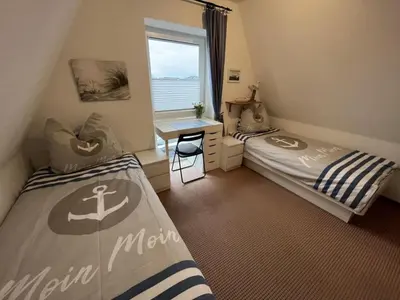 Ein Bett oder Betten in einem Zimmer der Unterkunft Ringwall 80a