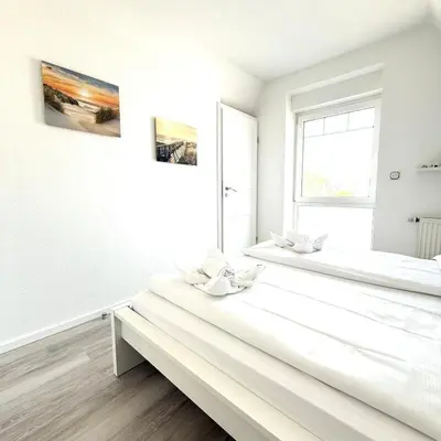 Ein Bett oder Betten in einem Zimmer der Unterkunft Ringwall 80b