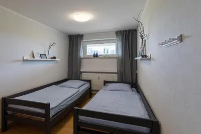 Ein Bett oder Betten in einem Zimmer der Unterkunft Haus Vogelsand, App 309