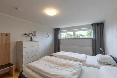 Ein Bett oder Betten in einem Zimmer der Unterkunft Haus Vogelsand, App 309