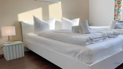 Ein Bett oder Betten in einem Zimmer der Unterkunft Ferienhaus James