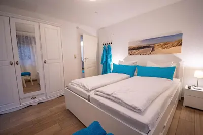 Ein Bett oder Betten in einem Zimmer der Unterkunft Kapitänshaus FeWo 2