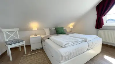 Ein Bett oder Betten in einem Zimmer der Unterkunft Haus Kirsten Haus Kirsten FeWo 5