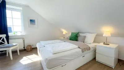 Ein Bett oder Betten in einem Zimmer der Unterkunft Haus Kirsten Haus Kirsten FeWo 6