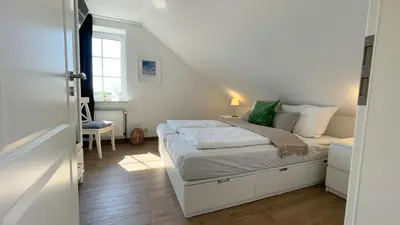 Ein Bett oder Betten in einem Zimmer der Unterkunft Haus Kirsten Haus Kirsten FeWo 6