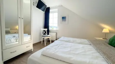 Ein Bett oder Betten in einem Zimmer der Unterkunft Haus Kirsten Haus Kirsten FeWo 6