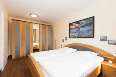 Ein Bett oder Betten in einem Zimmer der Unterkunft Kurpark-Residenz 107