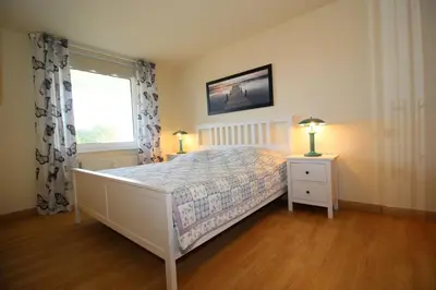 Ein Bett oder Betten in einem Zimmer der Unterkunft Kurpark-Residenz 108