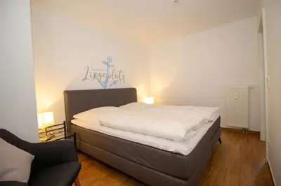 Ein Bett oder Betten in einem Zimmer der Unterkunft Kurpark-Residenz 142