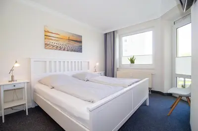 Ein Bett oder Betten in einem Zimmer der Unterkunft Kurpark-Residenz 121