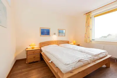Ein Bett oder Betten in einem Zimmer der Unterkunft Kurpark-Residenz 210