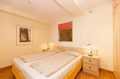 Ein Bett oder Betten in einem Zimmer der Unterkunft Kurpark-Residenz 242