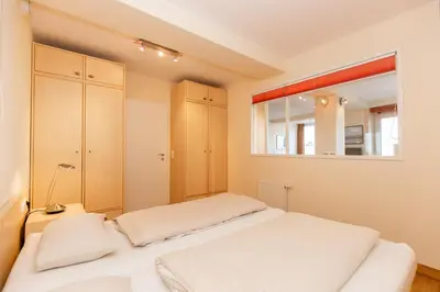 Ein Bett oder Betten in einem Zimmer der Unterkunft Kurpark-Residenz 242