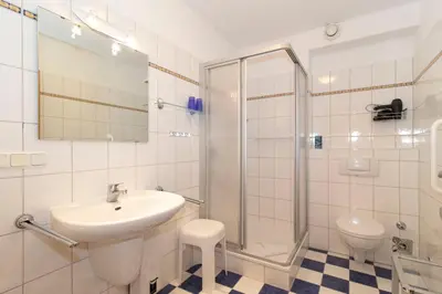 Ein Badezimmer in der Unterkunft Kurpark-Residenz 208