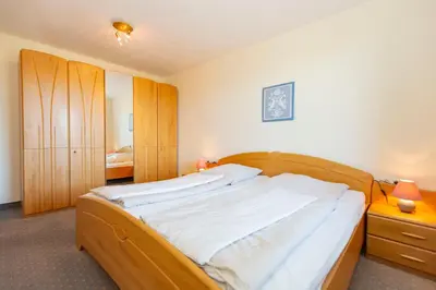 Ein Bett oder Betten in einem Zimmer der Unterkunft Kurpark-Residenz 207