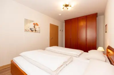 Ein Bett oder Betten in einem Zimmer der Unterkunft Kurpark-Residenz 234