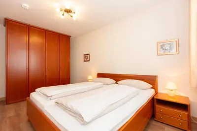 Ein Bett oder Betten in einem Zimmer der Unterkunft Kurpark-Residenz 234