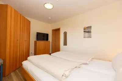 Ein Bett oder Betten in einem Zimmer der Unterkunft Kurpark-Residenz 123